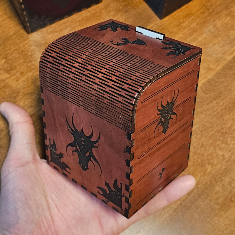 Brown laser cut card deck box with dragon motifs and waffle flex technology to allow the box to open.